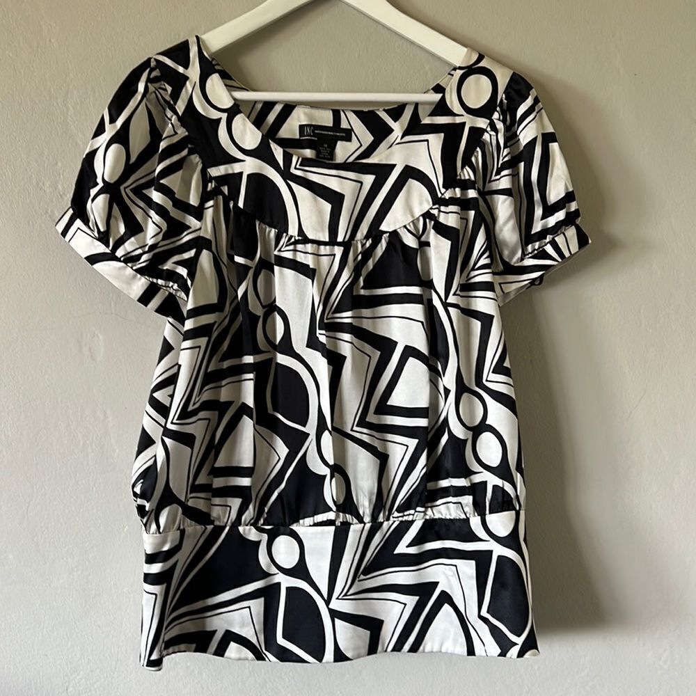 INC International Concepts silk blouse with geometric black and white print.